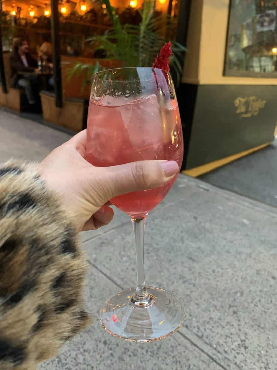 Hand holding a cocktail