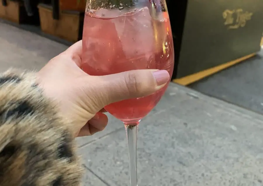 Hand holding a cocktail
